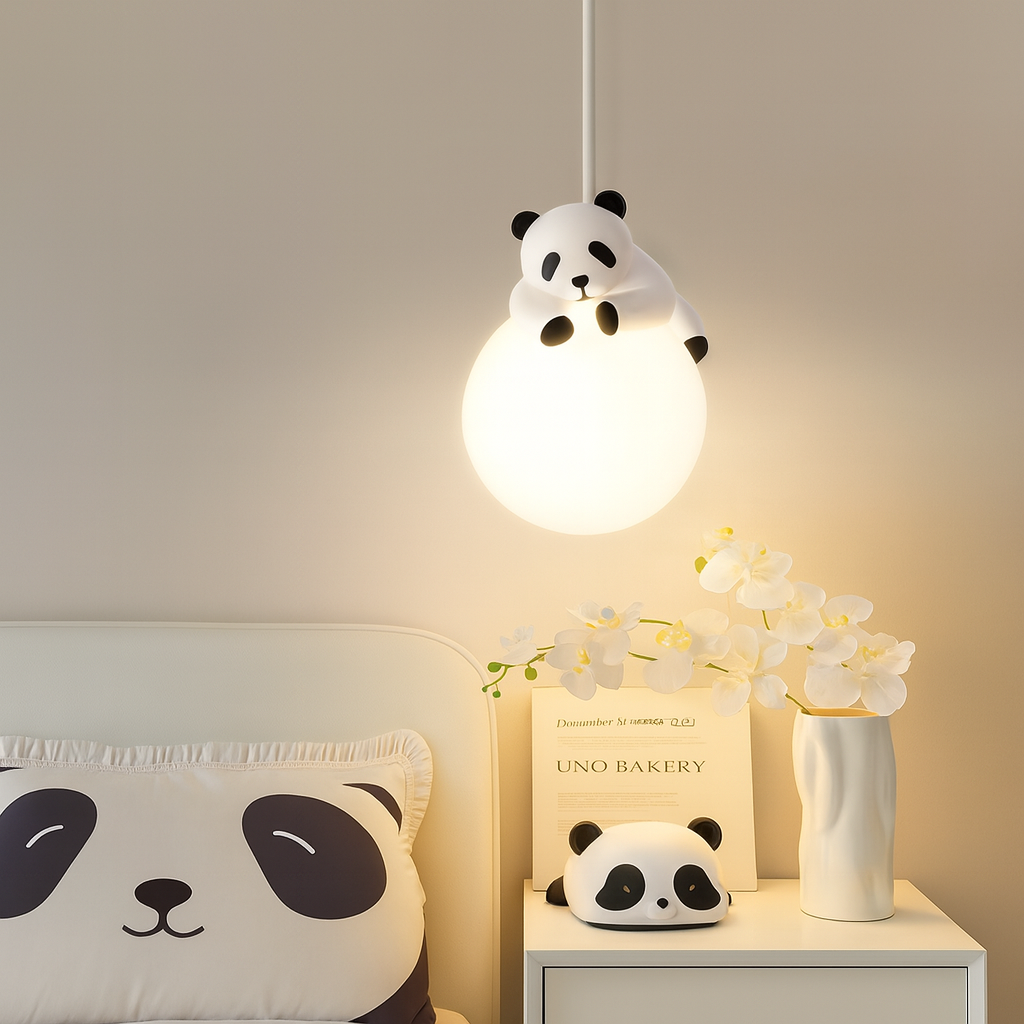 Panda-themed lampshade on a light fixture with panda decorations around in a room.