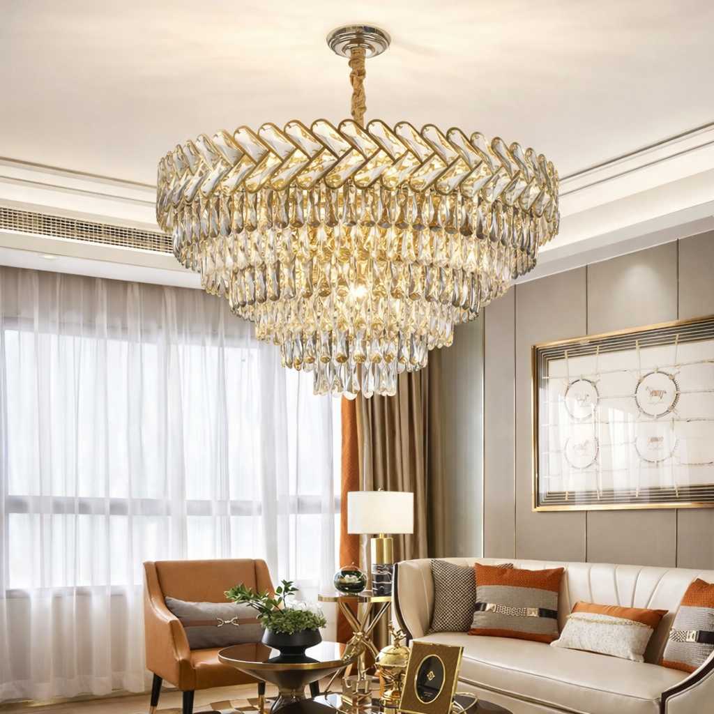 Luxurious chandelier hanging in a living room with a sofa and armchair.