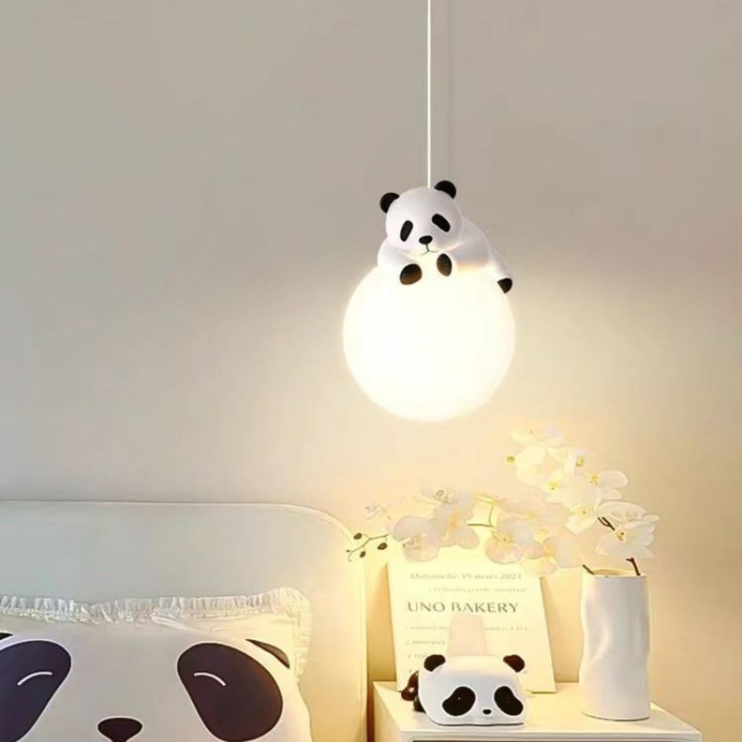 Panda-themed lamp hanging above a table with decorative items.