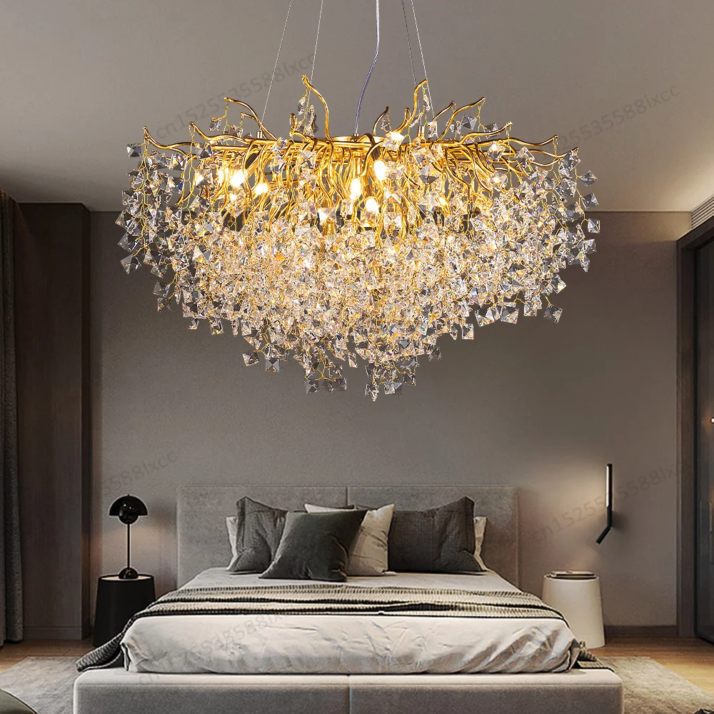 Luxurious chandelier hanging above a bed in a bedroom setting