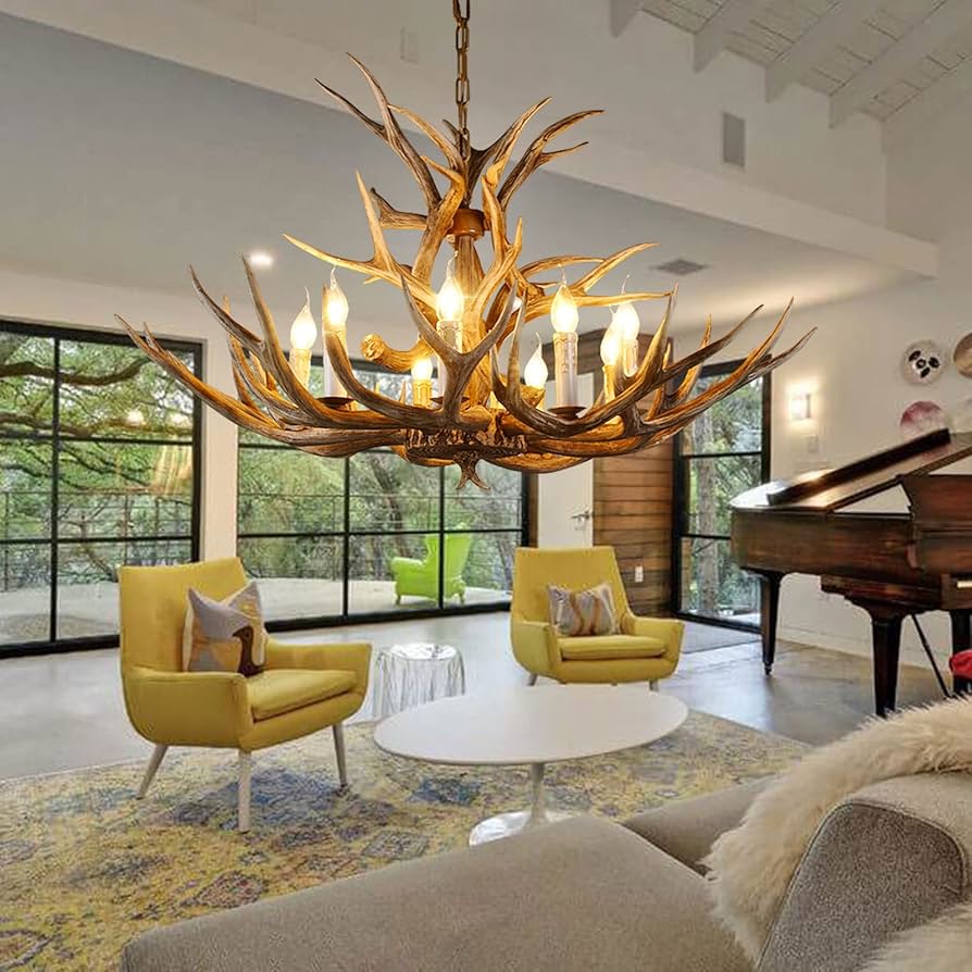 Luxurious living room with a large antler-style chandelier, yellow chairs, and a grand piano.