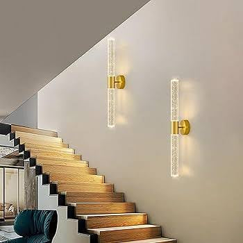 Modern wall lights on a staircase with a neutral background