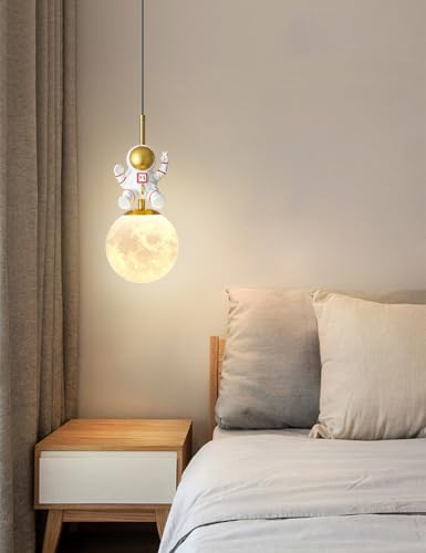 Modern pendant light above a bed in a bedroom setting