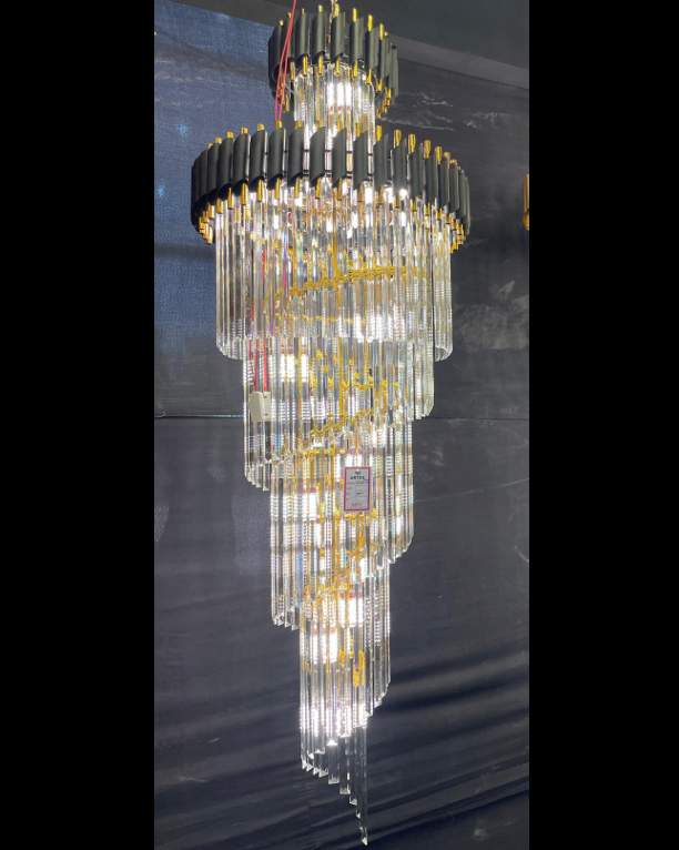 A spiral taper chandelier with metal structure and LED lights, featuring a black and golden color scheme.