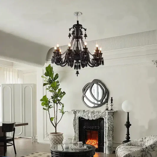 Living room with a black chandelier, fireplace, and decorative mirror.
