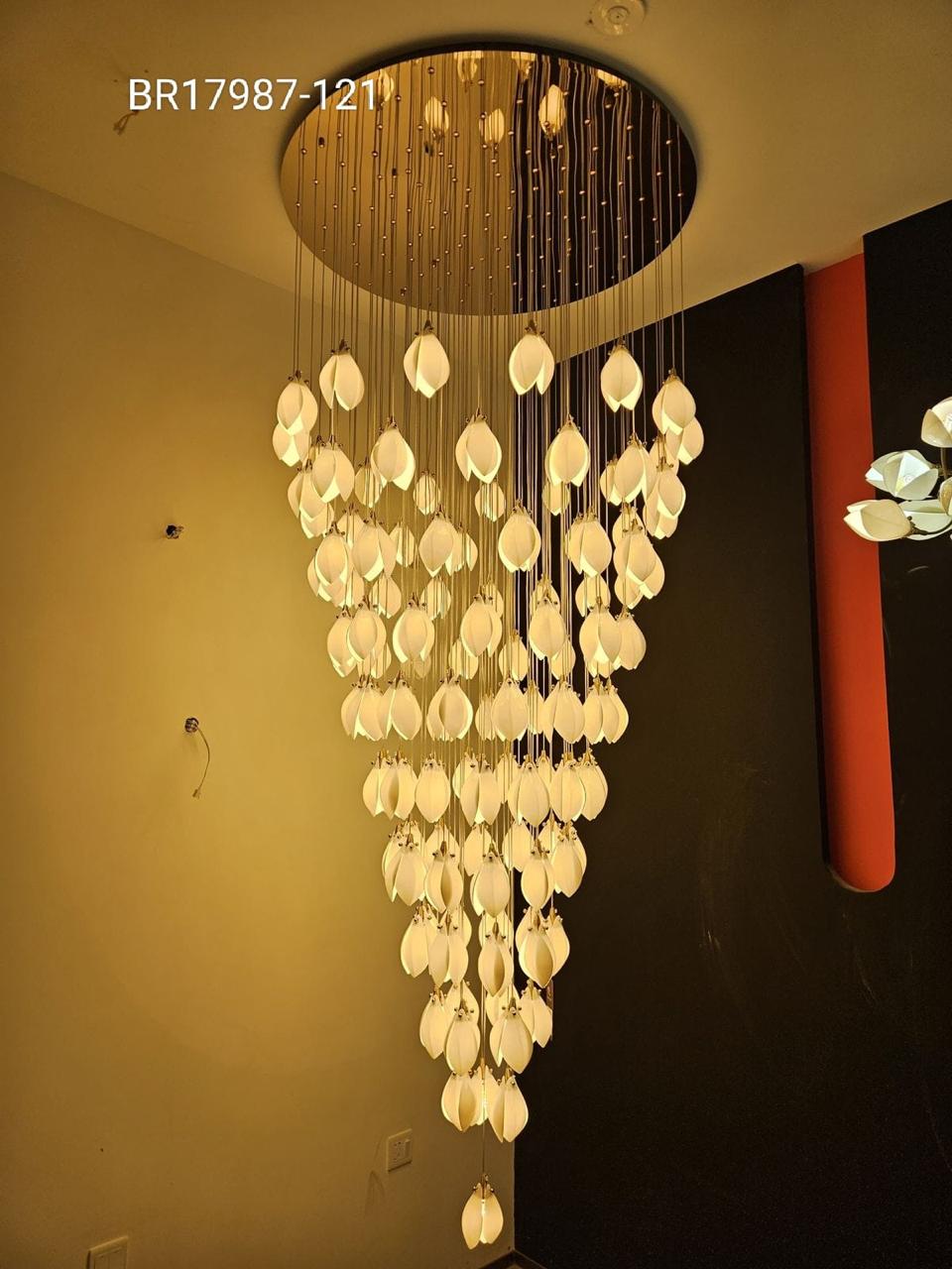 A gold-colored metal chandelier with a ceiling-mounted design featuring tulip-shaped LED lights.