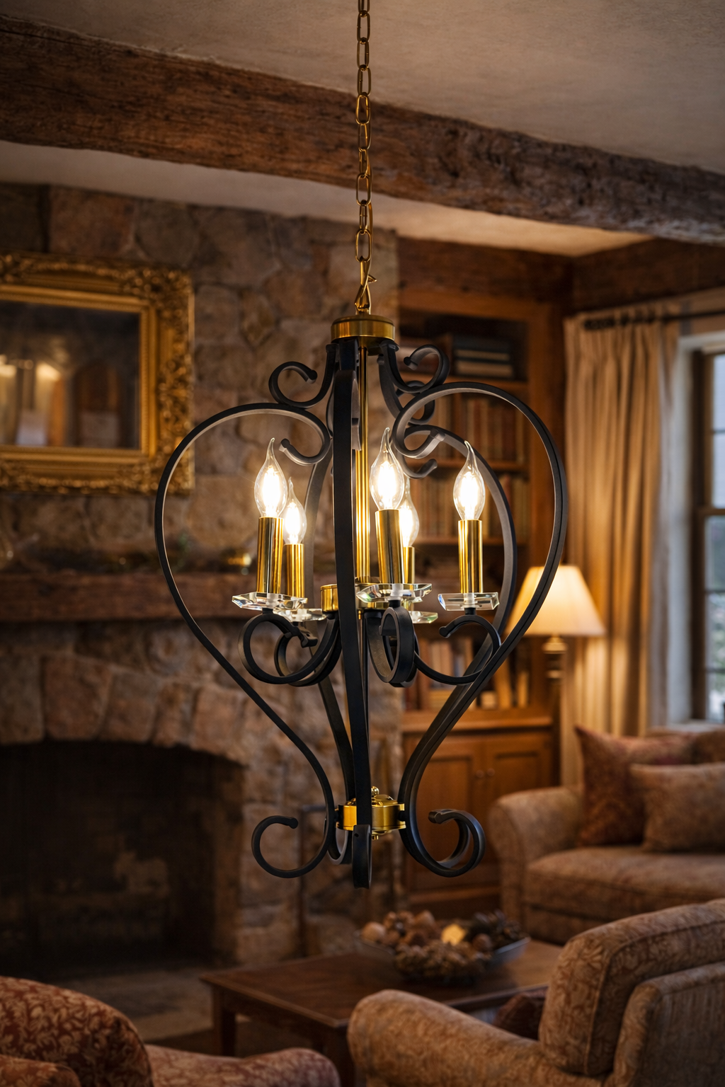 Decorative chandelier hanging in a cozy living room with a fireplace and furniture.