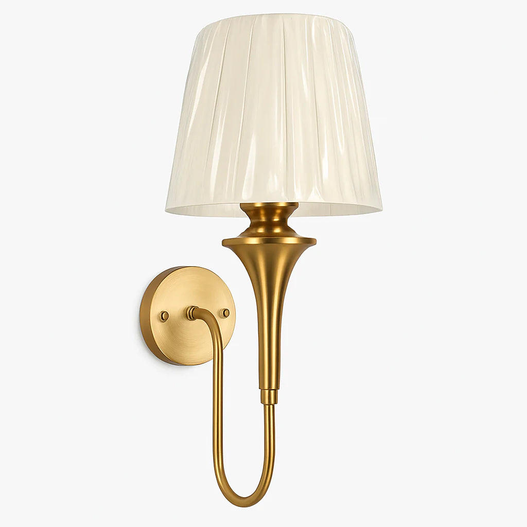 Wall-mounted lamp with gold fixture and white pleated shade on a light gray background