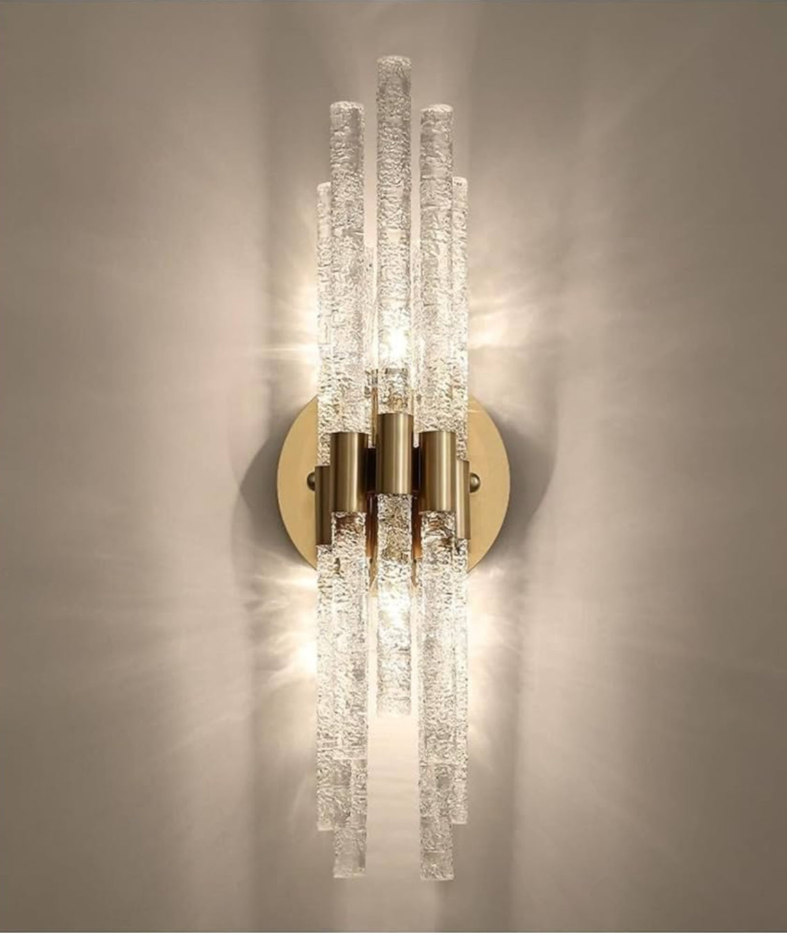 Decorative wall sconce with crystal-like design on a neutral background