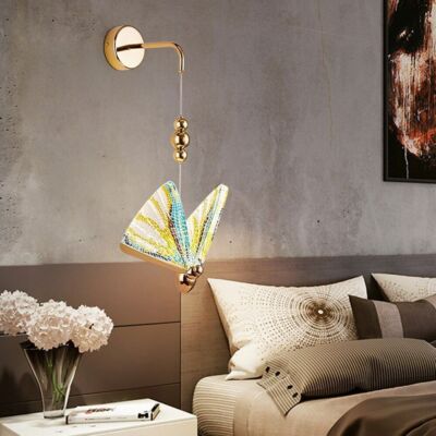Decorative wall lamp with colorful shade in a living room setting.