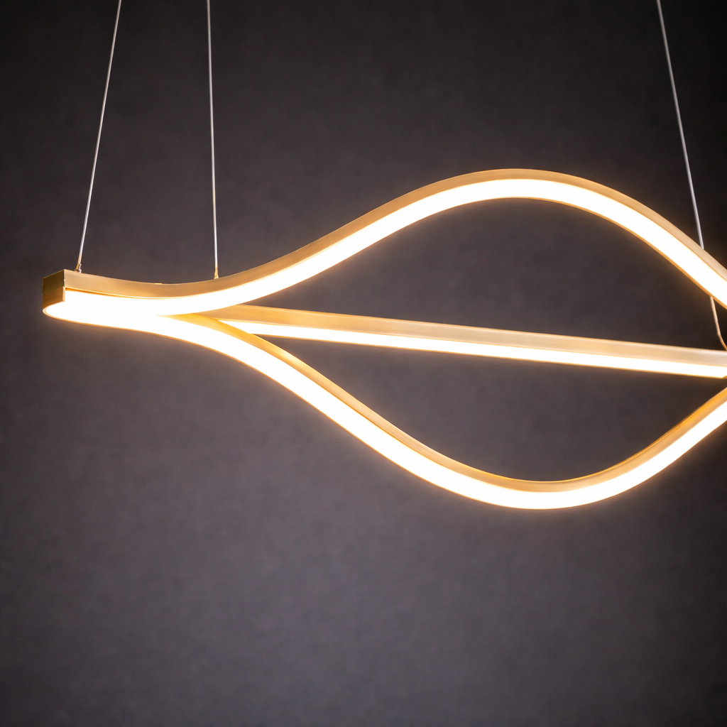 Modern pendant light with wavy design on a dark background